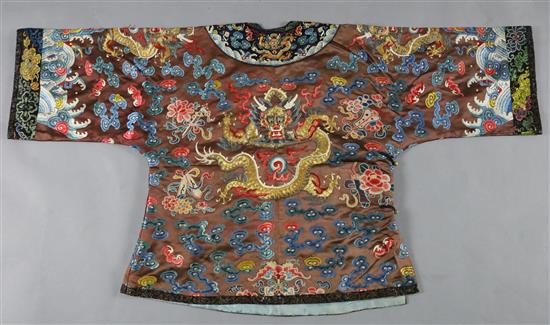 A Chinese embroidered silk and gold thread dragon jacket, late Qing dynasty, alterations